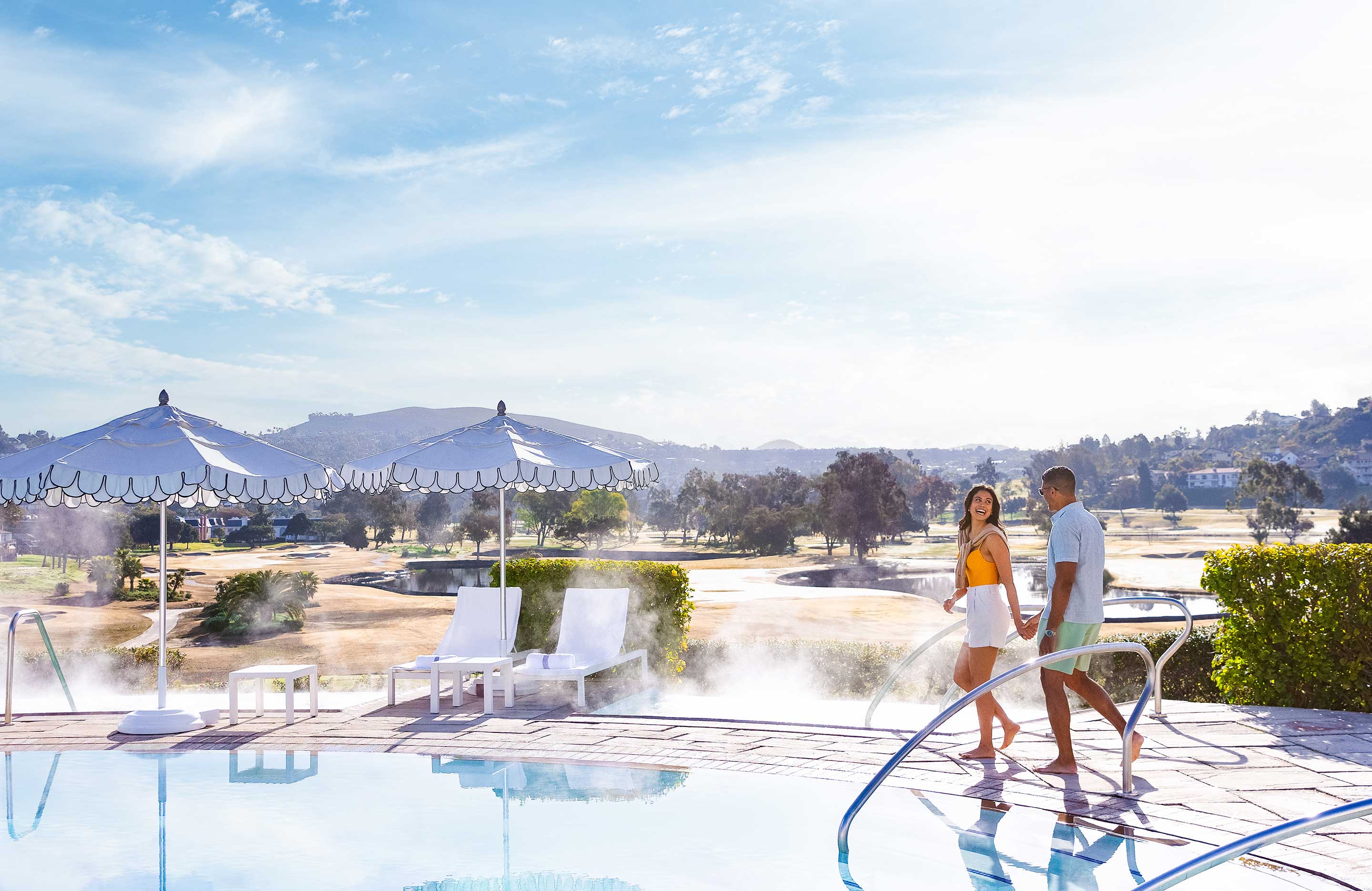 Couple walking by the pool