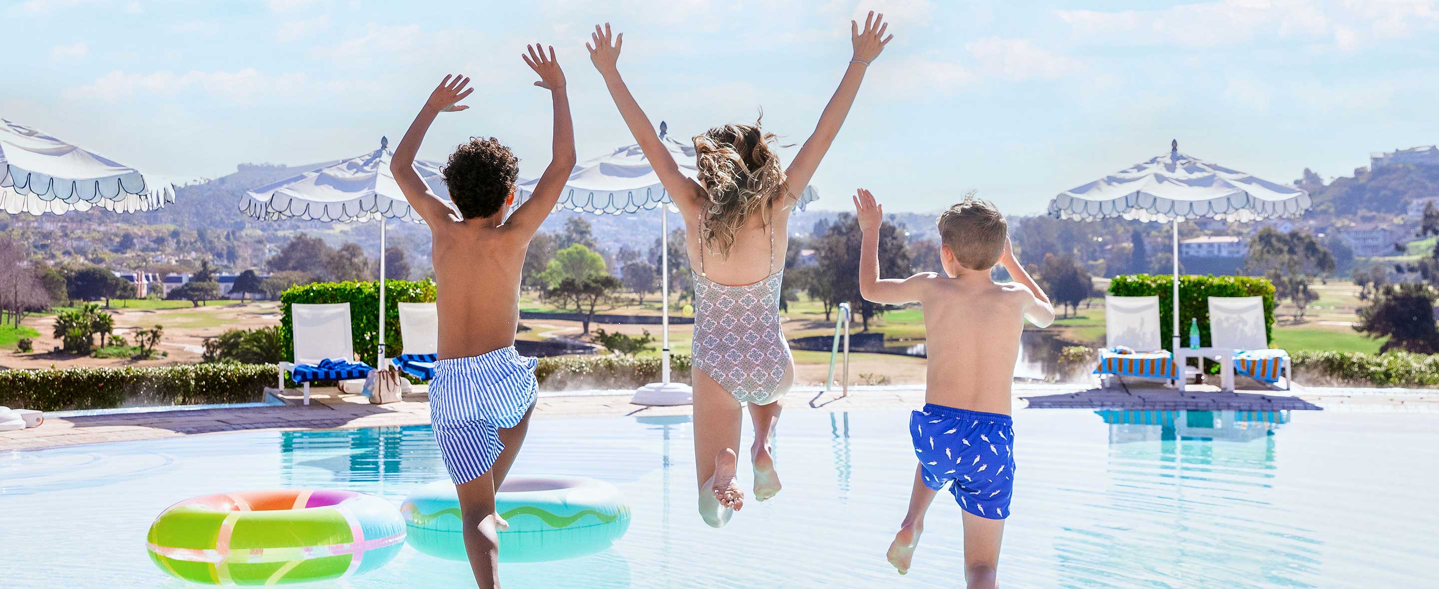 Kids jumping into the pool