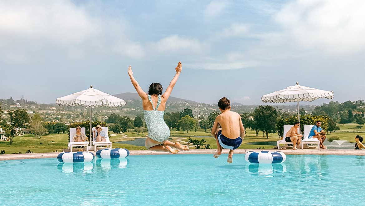 Kids jumping in the pool