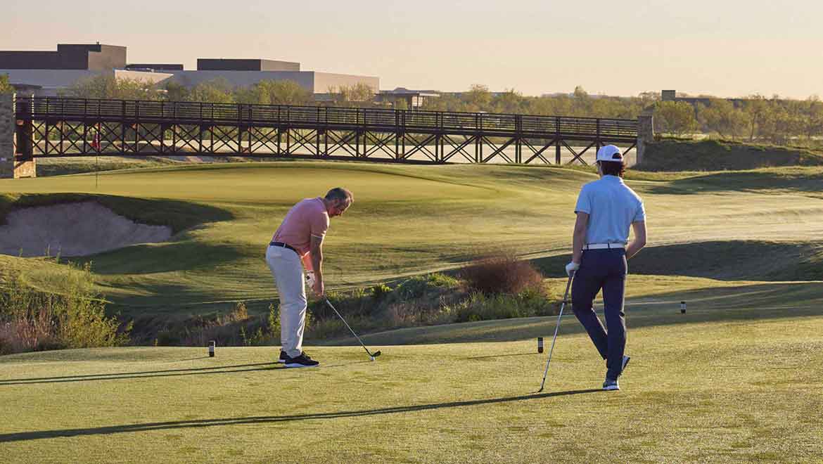 Father and son golfing