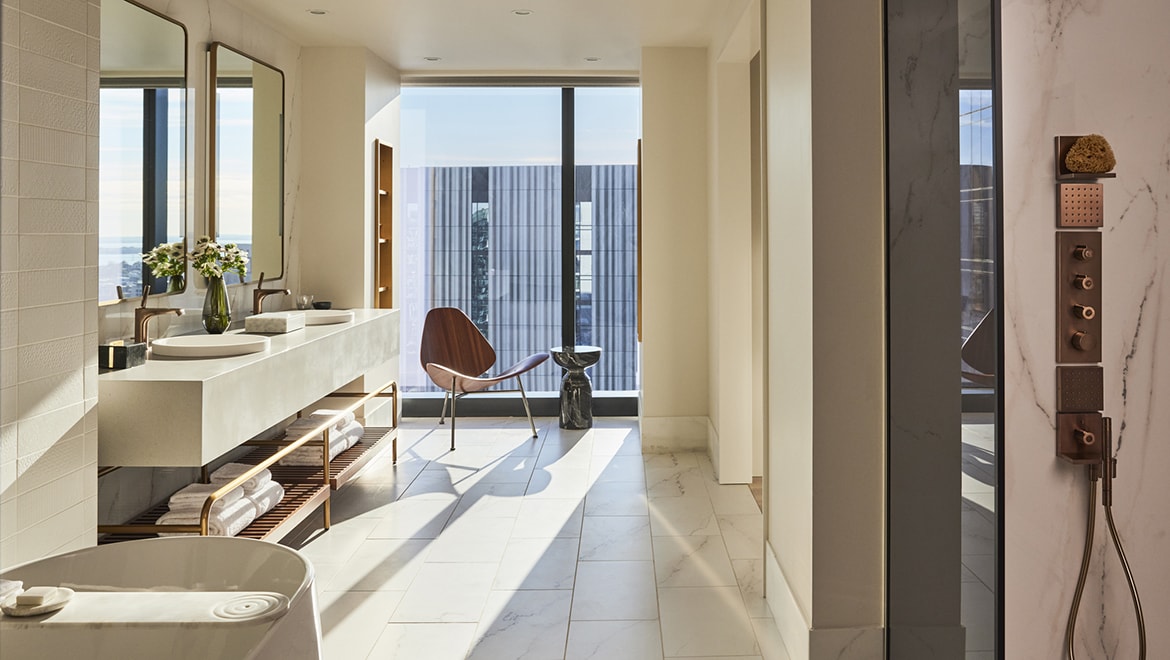 The master bathroom in the Director and Choreographer Suites offers a sense of visual poetry and graceful movement - Omni Boston Hotel at the Seaport