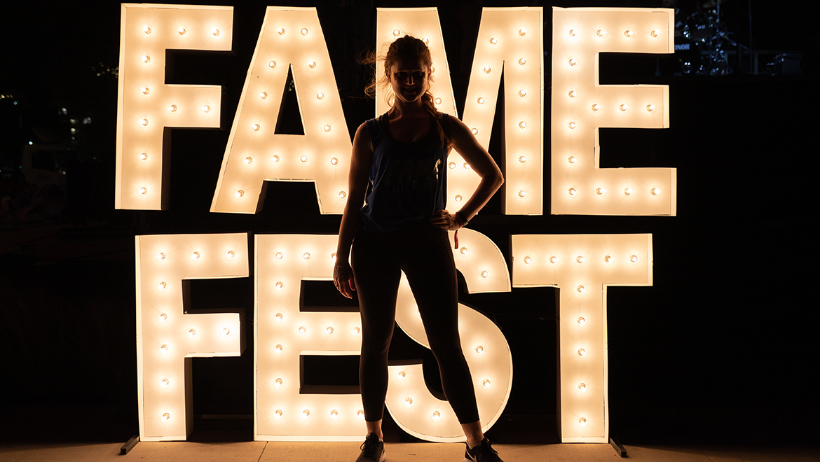 Woman on stage at Fame Fest