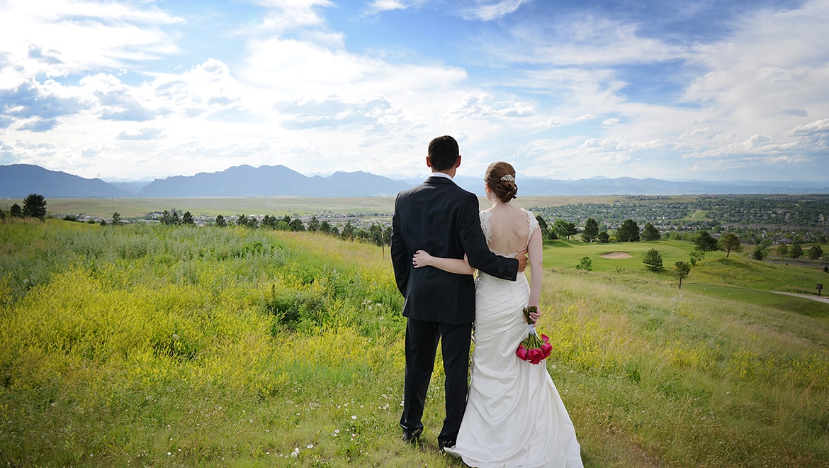 Omni Denver Interlocken wedding bride and groom in field