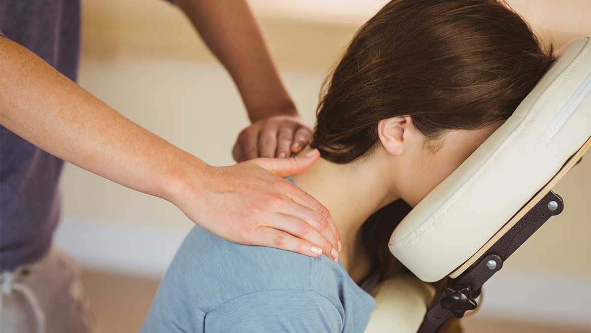 Woman getting a shoulder massage