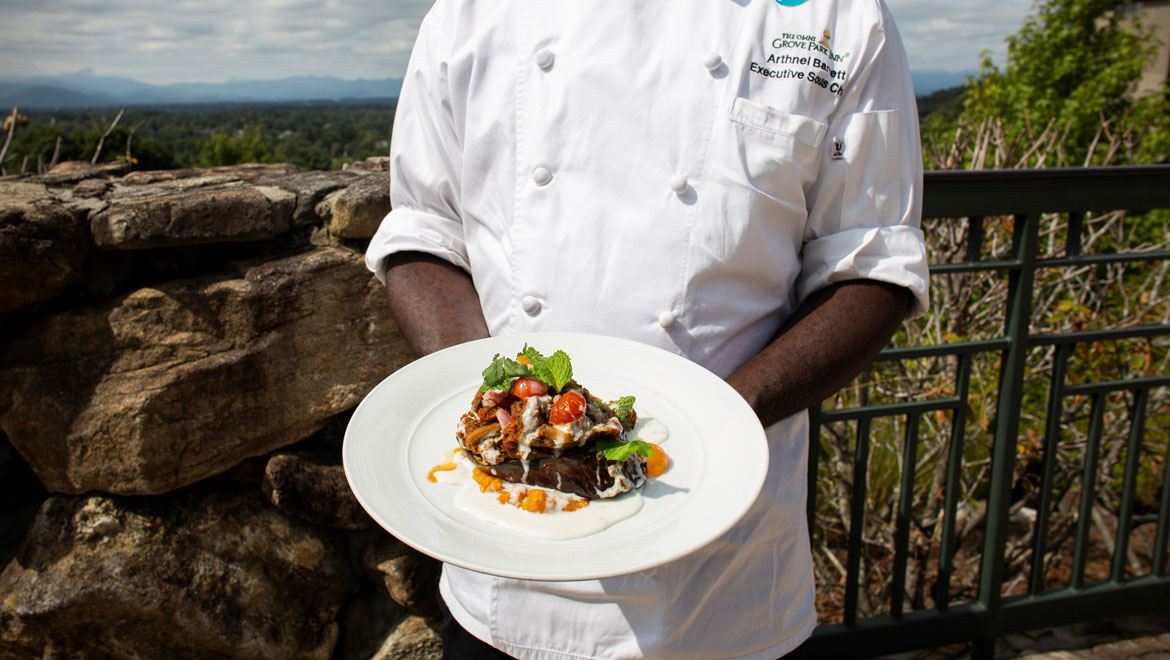 Chef holding entrée