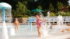 Girl playing in the fountain at Homestead