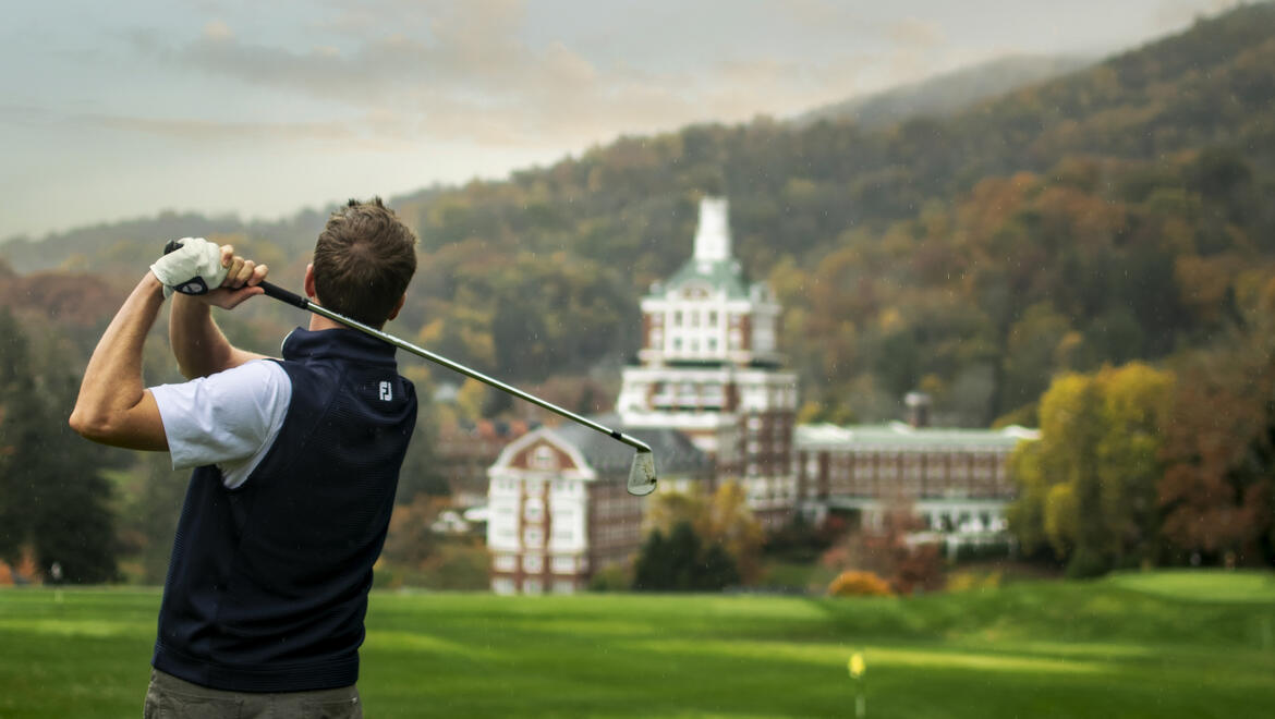 Man golfing at Omni Homestead Resort