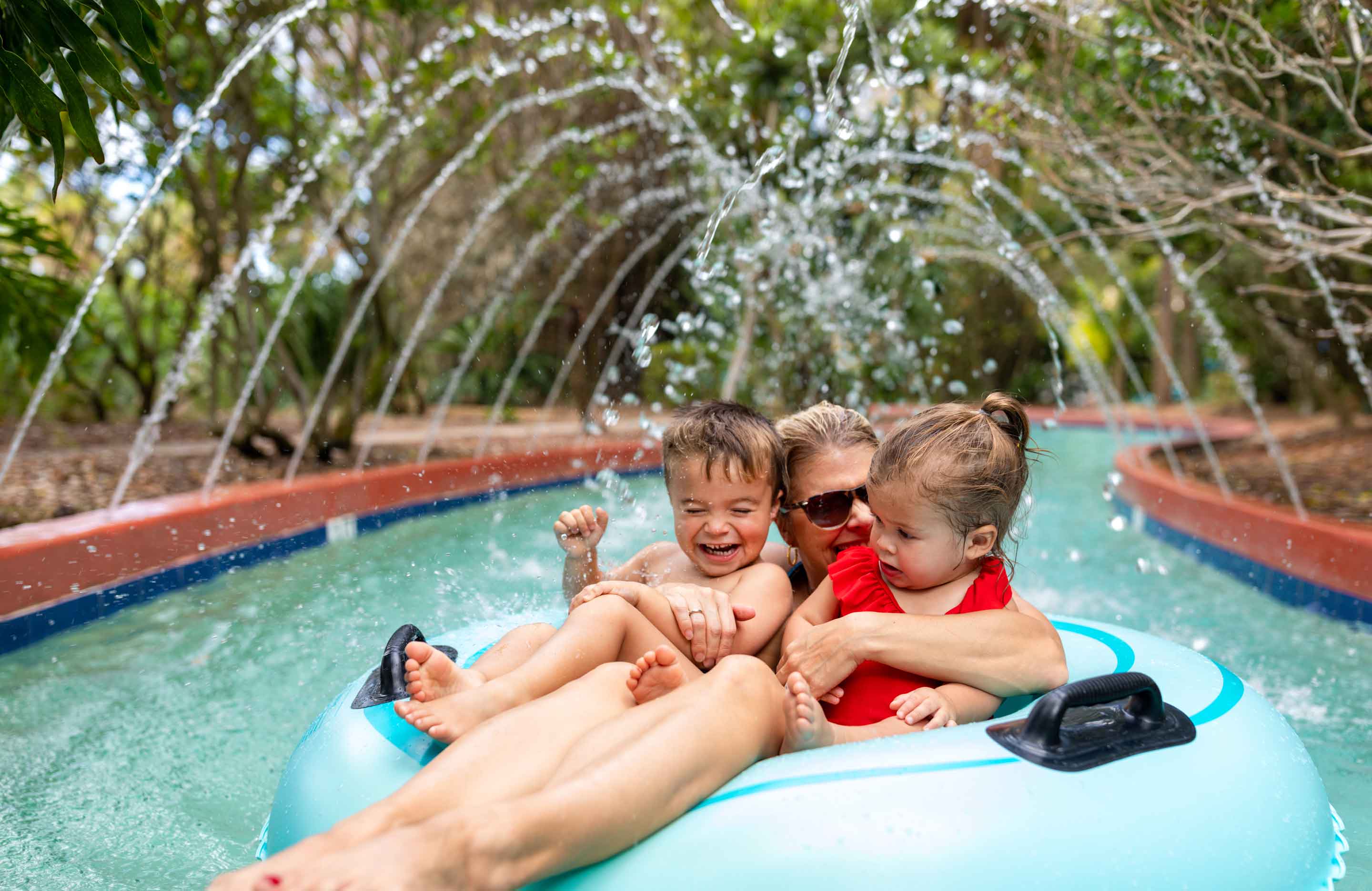 Family floating the lazy river.