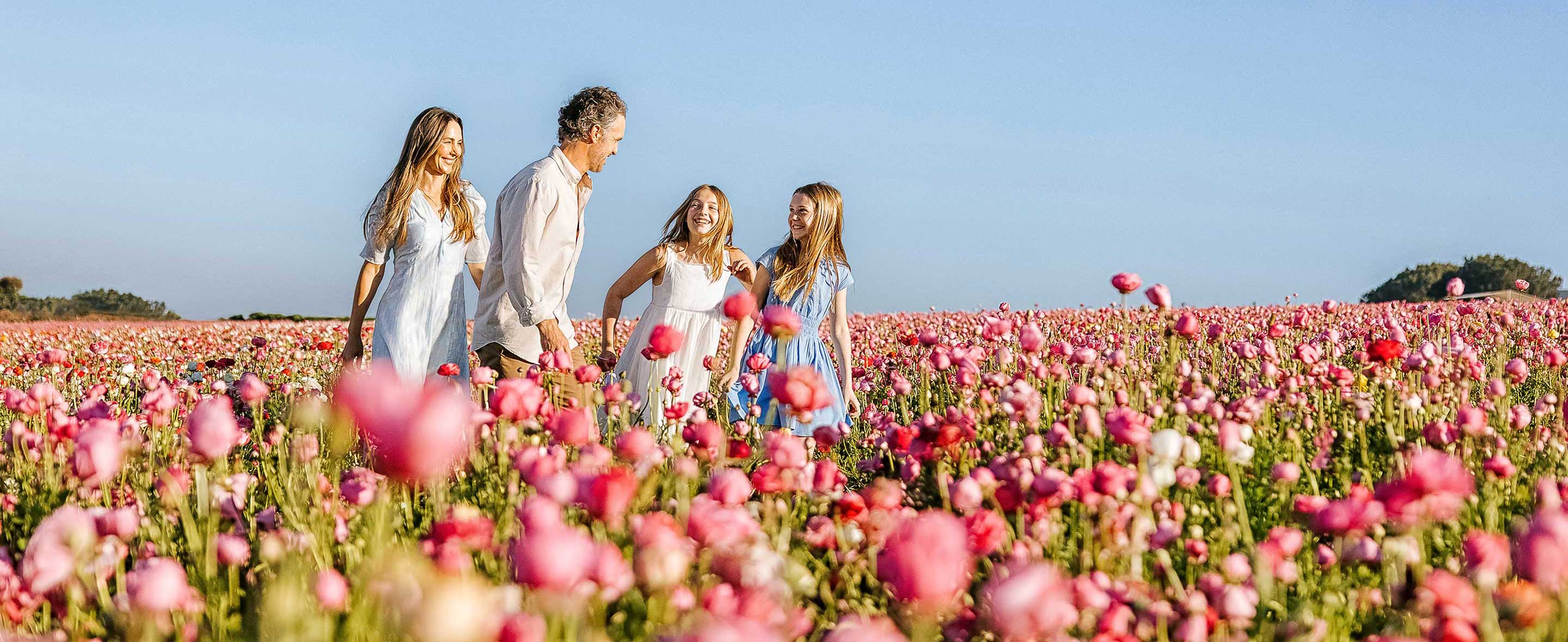 Family in flower fields