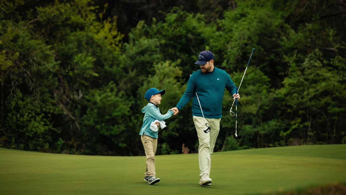 Father and son golfing
