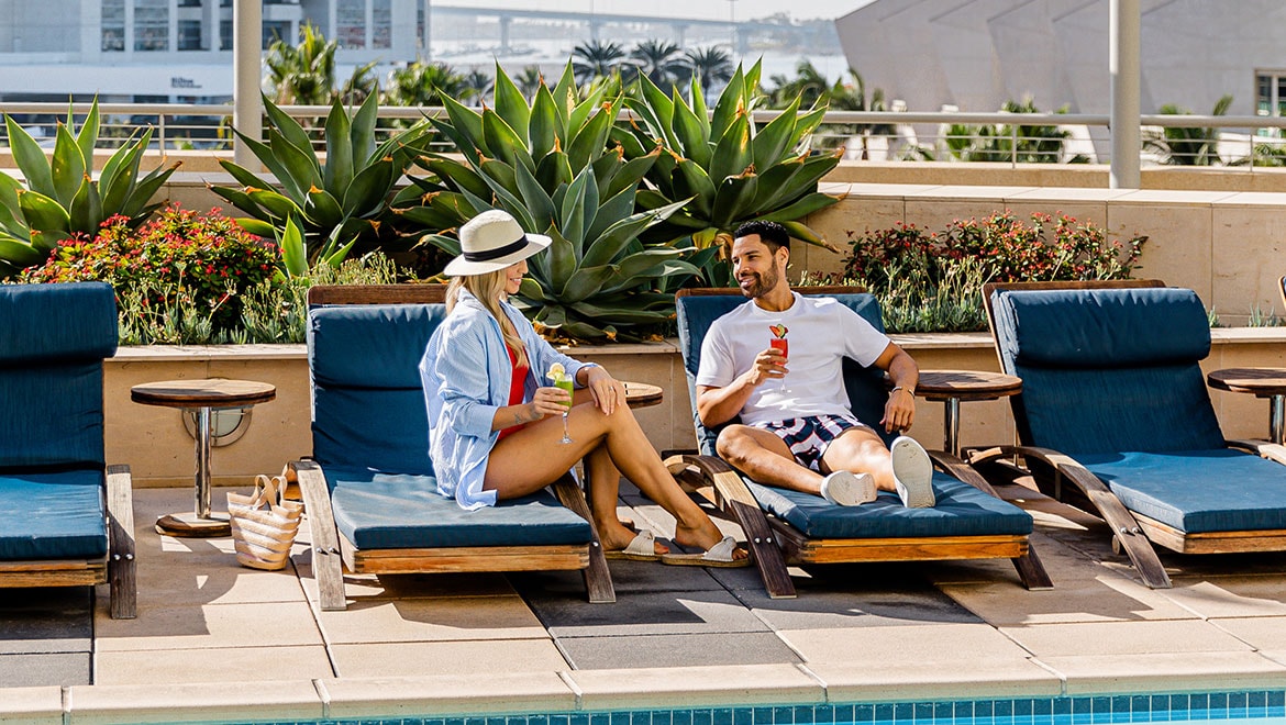 People lounging poolside
